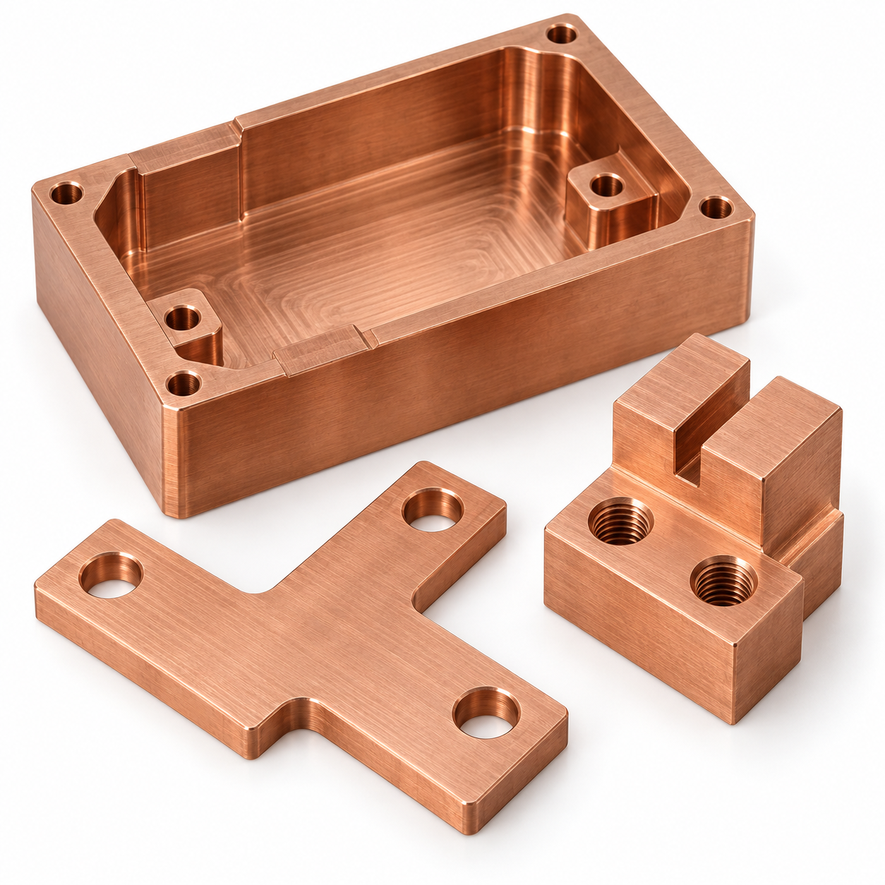 Close-up representative copper machined components with bores, threads and finished surfaces